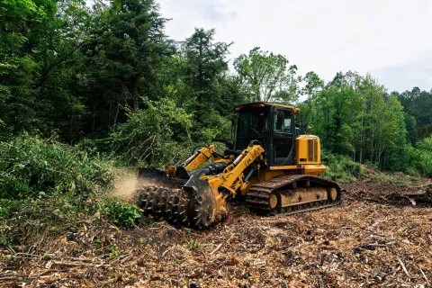 Track-type tractor mulching site clear and grub